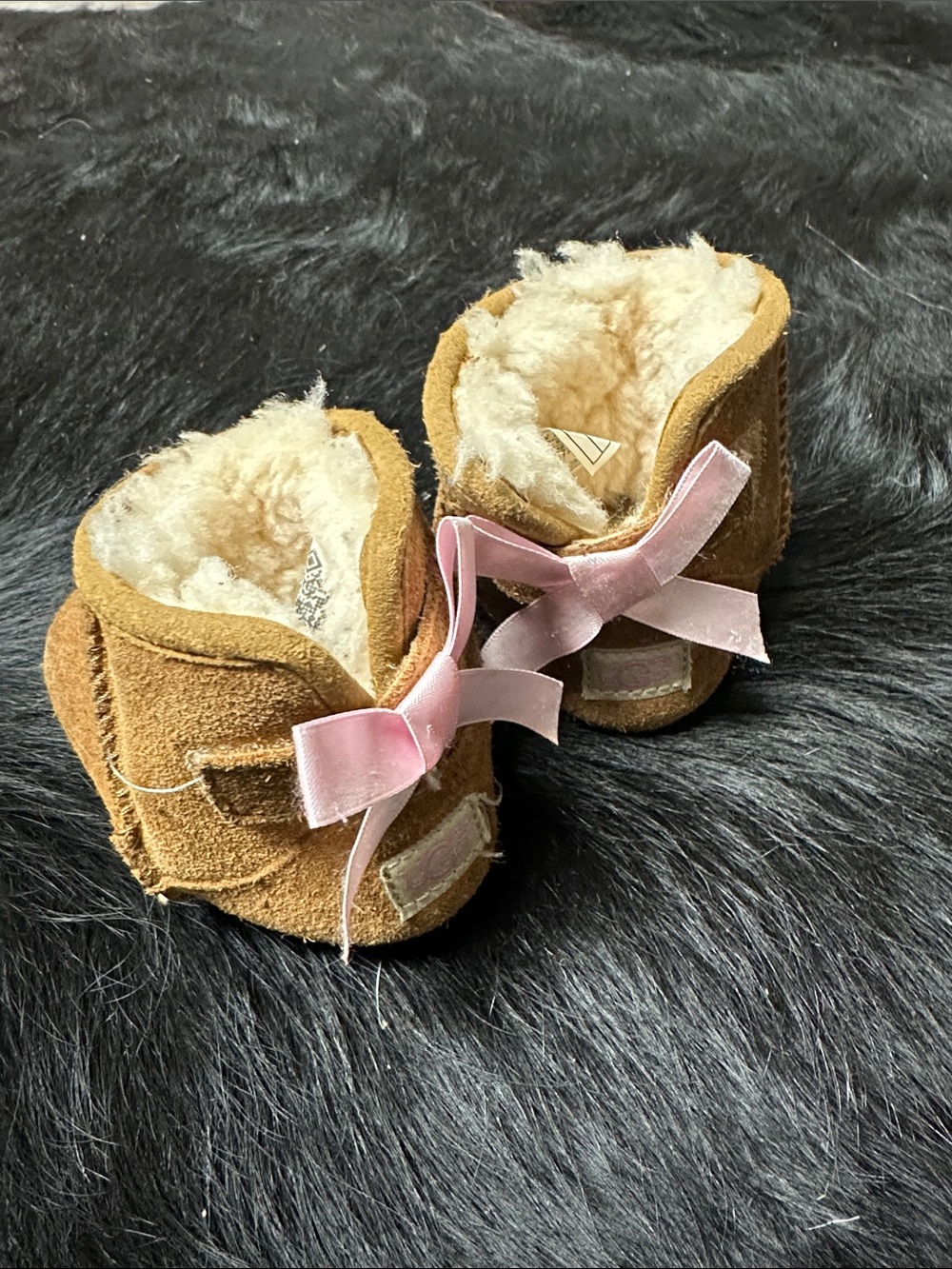 UGG Kids Chestnut Sheepskin Moccasins with Pink Bows